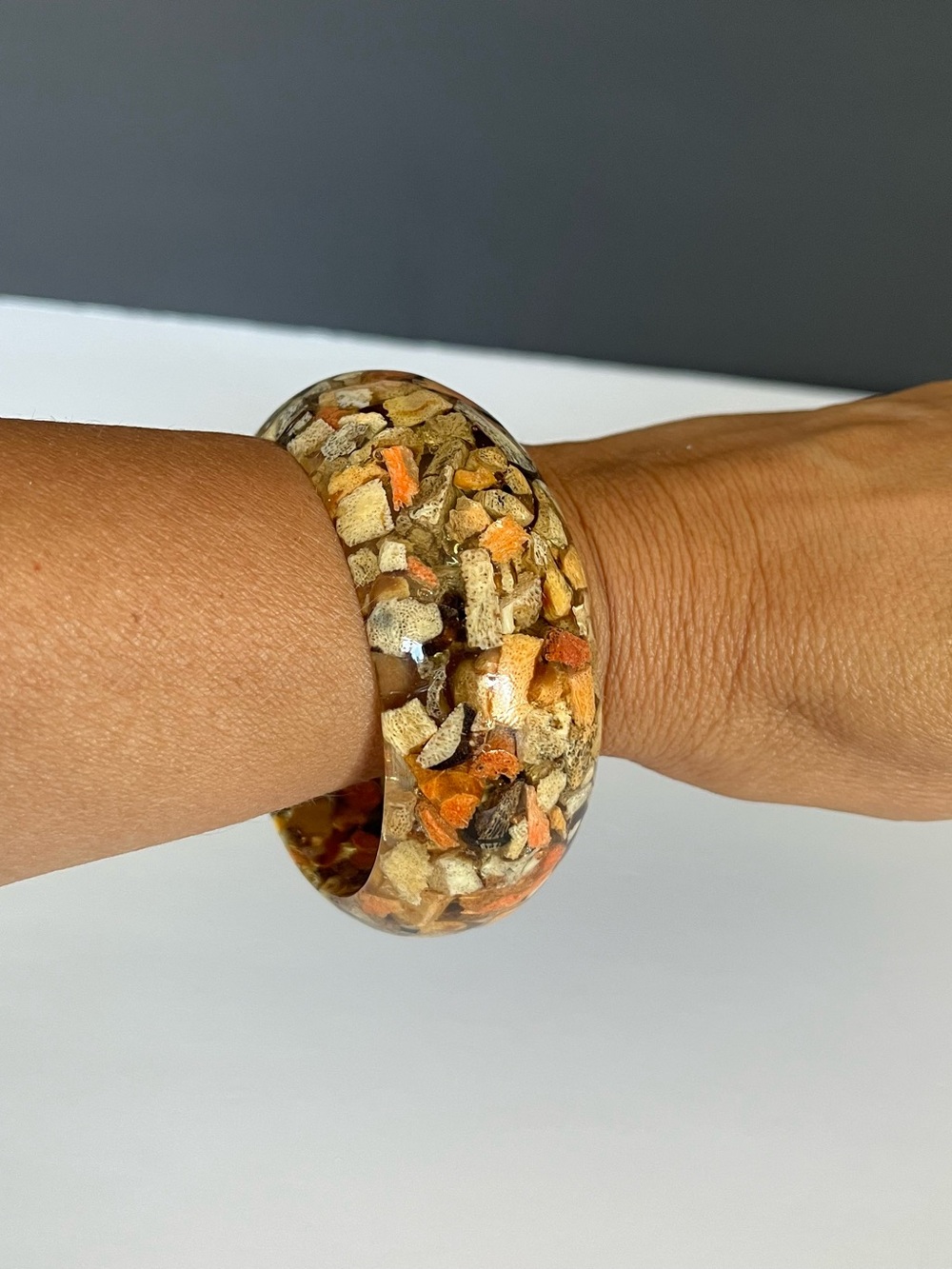 vintage 1950s Lucite bangle bracelet with embedded sponge coral chips